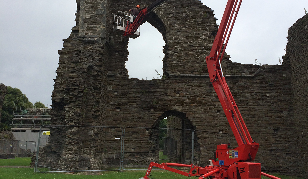 Cherry picker hire for masonry repair work at Caerphilly Castle, South Wales